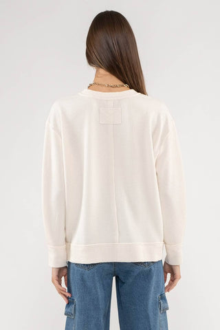 RAW EDGE SPLIT NECK AND HEM RIB KNIT TOP: CREAM