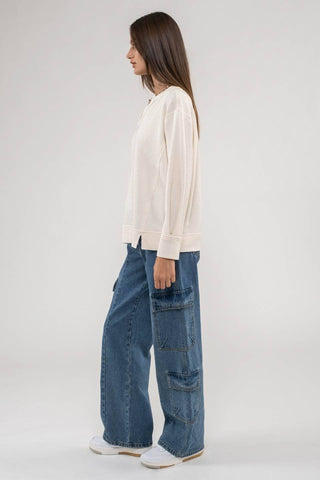 RAW EDGE SPLIT NECK AND HEM RIB KNIT TOP: CREAM