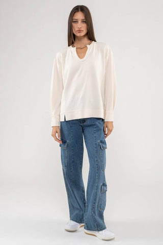 RAW EDGE SPLIT NECK AND HEM RIB KNIT TOP: CREAM